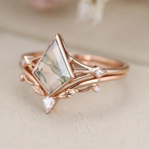 Elevate your bridal style with our Kite cut Natura Moss Agate engagement ring set, crafted in 14k Rose gold and paired with a vintage leaf wedding ring Fairy Wedding Rings, Leaf Wedding Ring, Leaf Wedding Rings, Pretty Engagement Rings, Alternative Wedding Rings, Moss Agate Engagement Ring, Cute Engagement Rings, Agate Engagement Ring, Ring Ideas