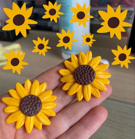 Hanade sunflowers from polymer clay. Ready to be made into earrings Clay Flowers How To Make Easy Video, Clay Sunflowers Diy, Air Dry Clay Sunflower, Sunflower Clay Art, Polymer Clay Crafts To Sell, Clay Sunflowers, Clay Magnets Diy, Sunflower Clay Earrings, Clay Magnet Ideas