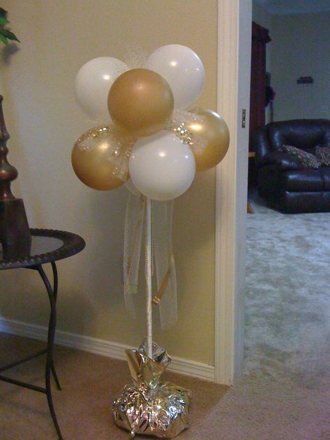 50th anniverary balloon bouquet. The dowel rod is inserted in a floral foam block with bags of beans to weigh it down, all covered in tissue paper! 50th Wedding Anniversary Decorations, 60th Anniversary Parties, 50th Anniversary Decorations, 25th Anniversary Party, Wedding Anniversary Decorations, 50th Wedding Anniversary Party, 50th Anniversary Party, 50 Years Anniversary, 60 Wedding Anniversary