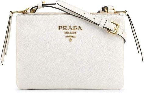 Leather
Imported
This Prada Women's White Vitello Phenix Leather Crossbody Handbag is a beautiful and elegant handbag that can be worn with everyday looks. It is practical yet luxurious and comes with an adjustable shoulder strap. 
Model number: 1BH046
Measurements: 9.75" x 1.5" x 6.5" (lwh) in inches.
White. Leather. Gold Hardware. Removable/Adjustable Shoulder Strap drop 21-23". Double Zip Closure. Two Exterior Pockets.
Includes authenticity cards and Prada Dust bag. Elegant Handbag, Prada Handbag, Paris Logo, Leather Handbags Crossbody, Prada Handbags, Back To School Outfits, Prada Bag, Bag Tags, Leather Crossbody Bag