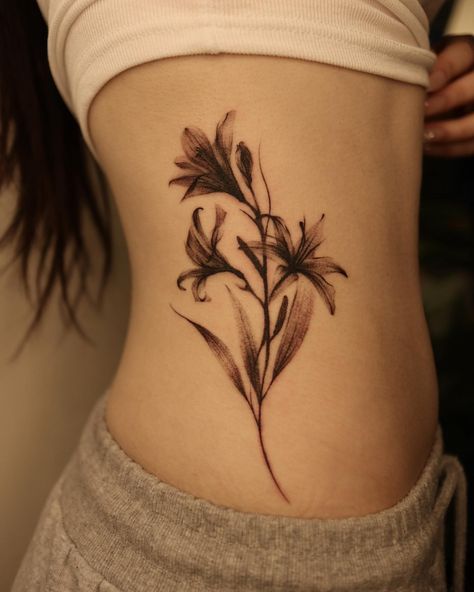 Lily Flower Tattoo Designs (All You Need To Know...And More!) - artfulinkdesigns.com Xray Flower Tattoo, Flower Tattoo Lily, Tattoo Lily Of The Valley, Small Lily Tattoo, Tattoo Lily, Between Breast Tattoo, Xray Flower, Abstract Flower Tattoos, Flower Tattoos For Women