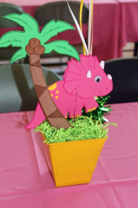 Pink dinosaur centerpiece Dino Centerpiece, Dino Girl Party, Girls Dinosaur Birthday, Dinasour Birthday, Baby Dinosaur Party, Girl Dinosaur Party, Girl Dinosaur Birthday, Jungle Theme Birthday, Dino Birthday Party