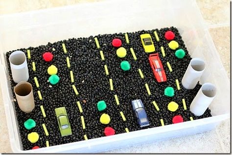 Cars themed sensory bin - lots of fun for toddler preschool and kindergarten age kids exploring roads, stop signs, and more! Candy Science Experiments, Candy Science, Sensory Beads, Pedestrian Safety, Car Activities, Halloween Sensory, Transportation Theme, Sensory Boxes, Creative Curriculum