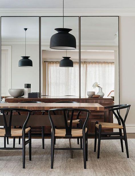 Modern dining space with black pendant lights, black midcentury dining chairs and floor to ceiling oversized mirrors. Mirror Dining Room, Dining Ideas, Minimalist Dining Room, Scandinavian Chairs, Mirrored Wall, Dining Room Wall Decor, Room Walls, Dining Room Small, Dining Room Inspiration