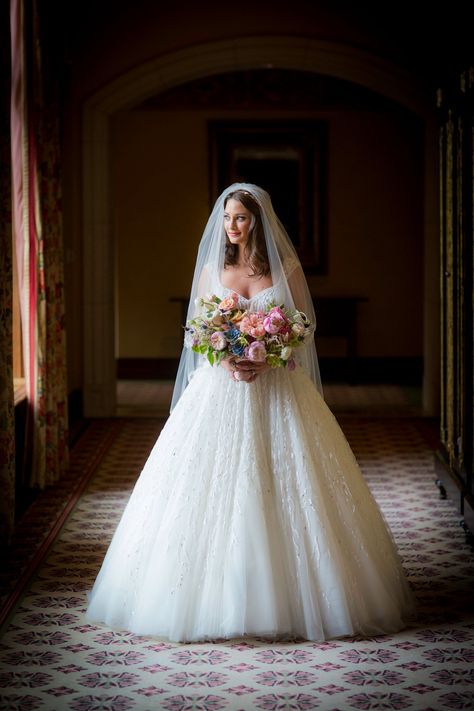 At last, his gorgeous bride made her grand entrance in a lovely ball gown with a cathedral-length veil carrying a colorful bouquet of peonies, poppies, anemone… Long Veils Bridal, Wedding Dress Veil, Bouquet Photo, Victoria Wedding, Kleinfeld Bridal, Wedding Inspired, Lace Bride, Long Veil, Wedding Dress With Veil