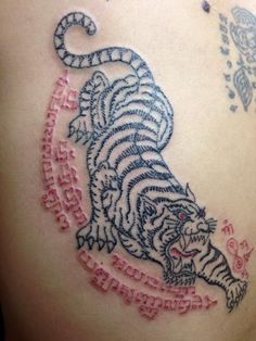 Thai Sak Yant tiger tattoo Thai Tiger Tattoo, Thai Tiger, Thai Sak Yant, Muay Thai Tattoo, Change Tattoo, Buddhist Tattoo, Sak Yant Tattoo, Tattoo Techniques, Tiger Tattoo Design