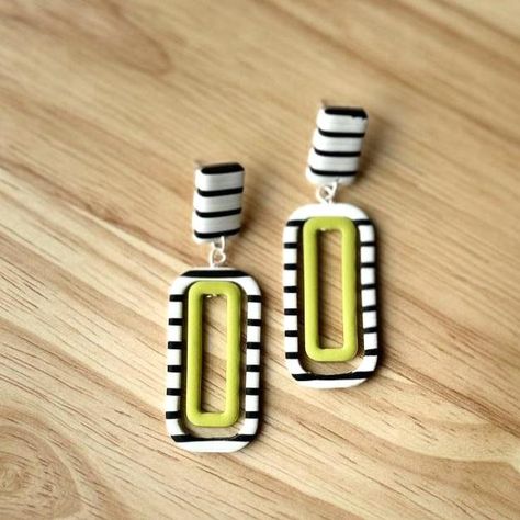 Introducing Strange, a bold and eye-catching earring with a unique inverted design. The larger rectangular stud showcases striking black and white stripes, while the smaller hollow green rectangle dangles below, creating a perfect balance of color and pattern. Made from lightweight polymer clay with hypoallergenic posts, Strange is the perfect accessory for those who love to embrace the unusual with a touch of modern flair. Hollow Purple, Diy Soda, Polymer Jewellery, Earring Clay, Striped Earrings, Earrings Polymer, Clay Inspiration, Polymer Clay Jewelry Diy, Polymer Crafts