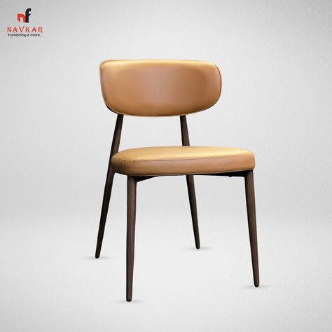 Introducing a modern dining chair with premium leatherette upholstery in a warm tan shade, designed for comfort and elegance. The cushioned seat and curved backrest offer ergonomic support, while the sturdy wooden legs are enhanced with subtle wood grains. A unique brass-finish metal accent connects the backrest to the legs, adding a touch of luxury to its minimalistic design. Perfect for contemporary interiors [chairs, dining chairs, interior design, furnishing] #ModernFurniture #DiningCha... Chairs Dining, Contemporary Interiors, Wooden Leg, Modern Dining Chairs, Minimalistic Design, Modern Dining, Metallic Accents, Contemporary Interior, Brass Finish