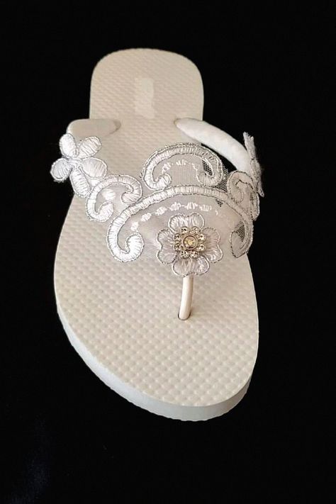 These comfy bridal wedges are perfect for any bride. If you’re into a little extra height, these wedges could be what you need. Keep this idea to your bridal footwear board. White Bridal Flowers, Communion Shoes, Bride Sandals, Lace Wedding Shoes, Wedding Wedges, Bridal Flip Flops, Wedding Flip Flops, Girls Flip Flops, Wedding Shoes Lace