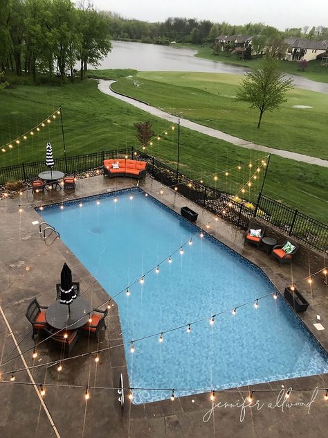 Outdoor Pool Area Ideas Entertaining, Area Around Pool Ideas, String Lights Around Pool Backyard, Lights For Pool Area, Lights Across Pool, Outdoor Lights Around Pool, Narrow Pool Deck Seating, Bistro Lights Over Pool, Around Pool Decor