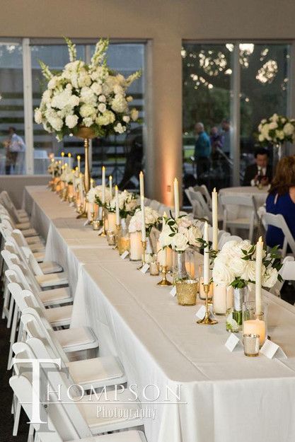 Capitol park museum, Louisiana wedding: seated dinner for a head table, led taper candlesticks with mixed gold mercury votives, candle decor for wedding reception Gold Taper Candles Wedding, Gold Votives Wedding Centerpieces, Candle Stick Centerpieces Wedding, Head Table With Candles, Gold Candlestick Centerpiece, Rectangle Table Centerpieces, Head Table Candles, Decor For Wedding Reception, Wedding Guest Table Centerpieces