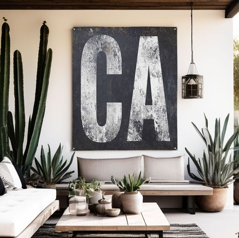 "Celebrate California's spirit with our 'CA' banner. White lettering on black, weather-resistant for indoor or outdoor. Embracing minimalist design, it's perfect for any setting, reflecting California's unique vibe. Durable and easy to hang, this banner blends style with state pride, making it an ideal addition to spaces wishing to capture the essence of the Golden State. From bustling cities to serene landscapes, it's more than decor; it's a statement of love for California.  HOW TO ORDER - VINYL BANNER  * MEASURE YOUR SPACE FIRST * To order, please just click the \"size\" & \"Add to Cart\" button at the top of the page and proceed to the checkout and leave personalized wording. * Your proof will be sent within 24-48 hours to your Etsy Email. * Production & Shipping 5-10 business days  VI Black And White Porch Ideas, Poolside Bar, Rustic Western Decor, Modern Farmhouse Home Decor, Art Palette, Vinyl Decor, Vinyl Banner, Home Bar Decor, Outdoor Setting