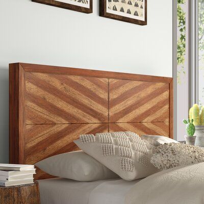 This clean-lined panel headboard is a stylish way to top off your bed in the main bedroom or guest room. Its square-shaped design is crafted from a blend of solid wood, and it boasts a distressed toffee-colored finish for a rustic look. The geometric panels in a two-toned hue add a decorative touch to your space. Its pre-drilled holes make installation a breeze thanks to the included mounting hardware. Plus, it's compatible with adjustable beds. Size: Queen | Mistana™ Tarin Solid Wood Panel Head Bohemian Style Bedding, Wood Panel Headboard, Geometric Headboard, Headboard Wood, Boho Headboard, Affordable Boho, Solid Wood Dresser, House Bedroom, Boho Chic Bedroom