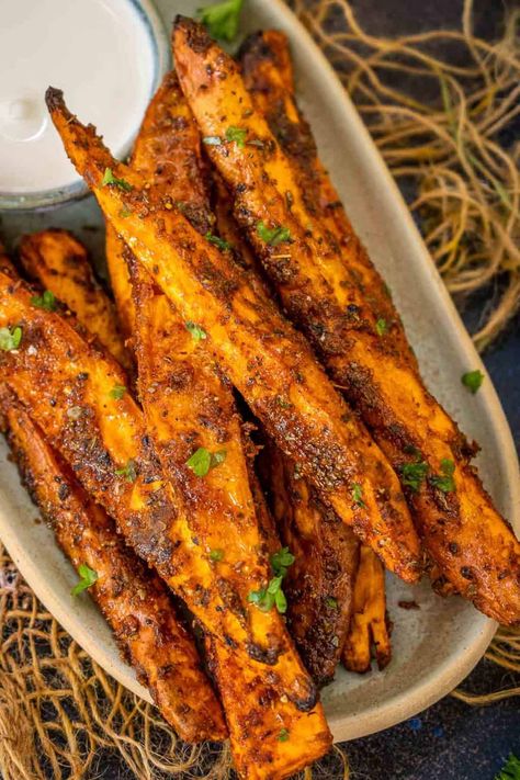 Crispy outside, creamy inside, and lightly spiced, these oven-roasted sweet potato wedges make for a healthy appetizer, snack, or side dish (vegan, gluten-free).