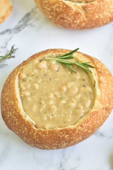 Garlic White Bean Soup, Vegan White Bean Soup Recipes, Vegan White Bean Soup, Vegan Bread Bowl Soup, White Bean Rosemary Soup, Creamy Vegan White Bean Soup, White Bean Kale Soup Vegan, White Bean And Fennel Soup, Vegan Bean Soup