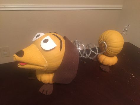 Slinky dog pumpkin #toystory #pumpkindecoratingideas Disney Decorated Pumpkins, Pumpkin Animals Ideas, Pumpkin Painting From Books, Boy Pumpkin Decorating Ideas, Slinky Pumpkin Craft, Movie Pumpkin Decorating Ideas, Veterinary Pumpkin Decorating, Pumpkin Contest Ideas No Carve Winners, Slinky Dog Pumpkin