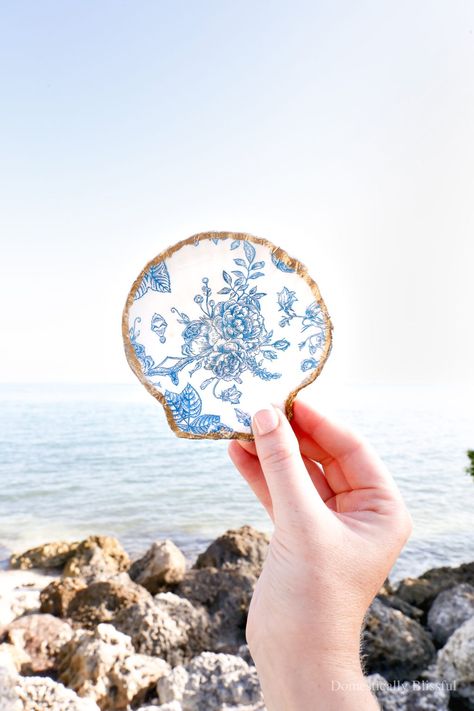 DIY Seashell Trinket Dish - Domestically Blissful. Summer beach DIY, kid and family vacation craft, shell jewelry holder. Beach DIY art shell. Trinket shell jewelry dish. Summer seashore craft, little mermaid shell, ring holder. Rainy Beach, Family At The Beach, Domestically Blissful, Ring Holder Diy, Jewlery Holder, Sea Shells Diy, Napkin Rings Diy, Diy Dish, Seashell Projects