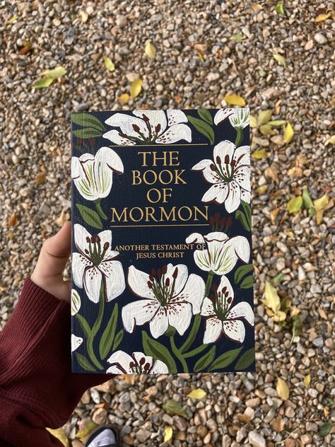 Message me for custom orders and hard-covers :) These one-of-a-kind, hand-painted Soft-Cover Book of Mormon started as Young Women camp project but quickly turned into one of my favorite ways to share my art with others.   The modern floral design is created by me and painted using acrylic then coated with a matte sealer to help your book remaining vibrant and beautiful. These books make a great gift for a baptism, for the hard-to-shop-for friend, or for yourself as you begin a new scripture journey!  There is something so exciting about an unmarked Book of Mormon, ready to be discovered and marked in brand new ways and sitting on your bedside table, doing double duty as a work of art! Decorate Book Of Mormon, Paint A Book Of Mormon, Decorating Book Of Mormon Cover, Hand Painted Book Covers, Painting Books Of Mormon, Book Of Mormon Cover Painting, Hand Painted Book Of Mormon, Painting On Book Covers, Book Of Mormon Painted Cover Ideas