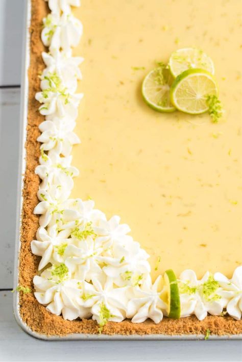 key lime slab pie with key limes and whipped cream Homemade Key Lime Pie, Easy Key Lime Pie, Graham Pie, Cracker Pie, Key Lime Pie Easy, Easy Custard, Homemade Graham Cracker Crust, Lime Desserts, Lime Pie Recipe