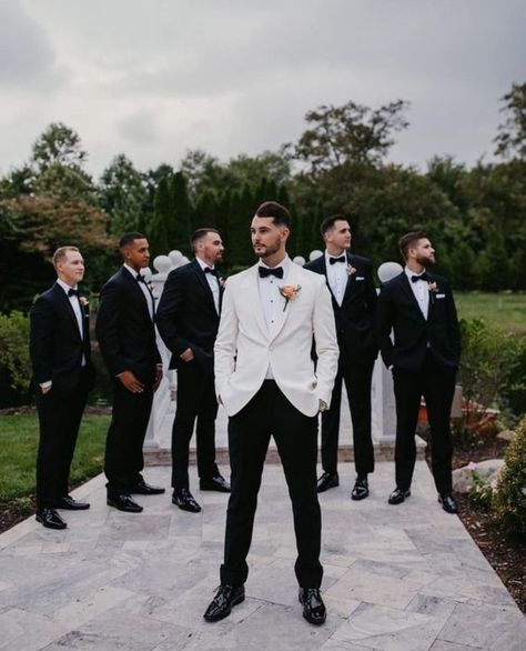 Black And White Grooms Suit, Groom And Bestman Suits, Classic Groom And Groomsmen Attire, White Groomsmen Suit, Formal Wedding Party Attire, White Groom Black Groomsmen, Groom In White Groomsmen In Black, Groomsmen Attire Classic, Wedding Guys Attire