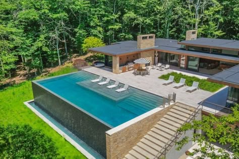 Infinity Edge Pool Backyards, Modern Infinity Pool Design, Villa With Infinity Pool, Infinity Pool With Waterfall, Infinity Edge Pool Design, Infinity Pools Backyard Ideas, Pool On A Hill Backyards, Elevated Pool Design, Infinity Pool Ideas