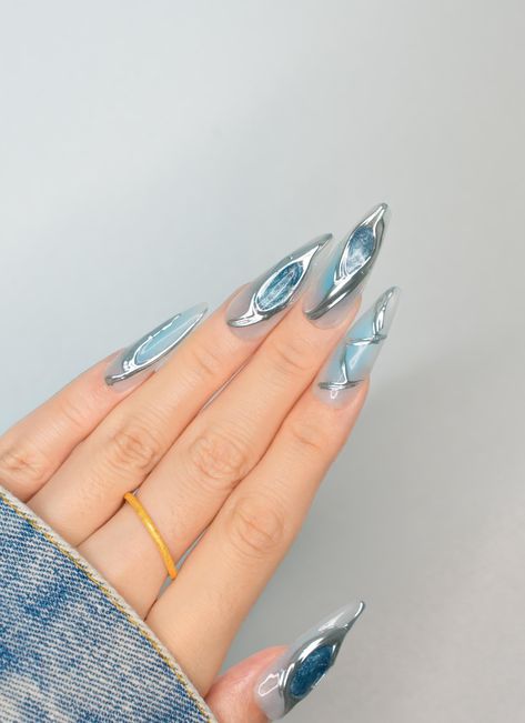 Transform your look this Halloween and holiday season with our Icy Blue and Silver 3D Long Stiletto Nails. These stylish press-on nails feature a stunning chrome metallic finish that captures the light beautifully. These nails are perfect for adding a touch of glam to any outfit--grab your set today and step into the spotlight with confidence! 🐰Sizing Guide: XS/S/M/L XS: 14-10-11-10-8 (mm) S: 15-11-12-11-9 (mm) M: 16-12-13-12-10 (mm) L: 17-13-14-13-11 (mm) 🐰 What's Included in Your Press-On Na Blue Silver Chrome Nails, Stiletto Nails Chrome, Blue Chrome Nails Designs, Nails Metallic Chrome, Futuristic Nails, Metallic Blue Nails, Icy Nails, Blue Stiletto Nails, Nails For Halloween