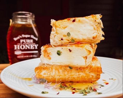 Honey drenched baked Feta in Phyllo Philo Feta Honey, Phylo Pastry Feta, Crispy Phyllo Wrapped Baked Feta With Honey, Baked Feta In Phyllo With Honey, Phyllo Feta, Greek Appetizer, Tomatoes And Cucumbers, Phyllo Pastry, Maple Syrup Recipes