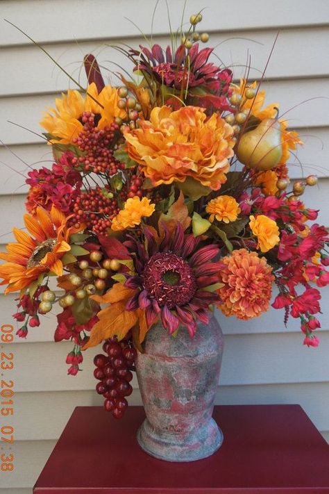 Beautiful Burgundy/Gold Country Pitcher Floral Arrangement  Autumn / fall flower arrangements  #fall #fallflowers #fallarrangement #flowerarrangements #camitidbits #fallfloral Pitcher Flower Arrangement, Thanksgiving Floral Arrangements, Thanksgiving Floral, Fall Centerpieces, Fall Bouquet, Altar Flowers, Large Flower Arrangements, Fall Flower Arrangements, Church Flower Arrangements