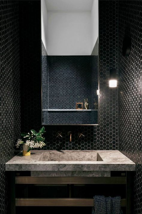 When it comes to bathroom design, bright whites and fun pops of color seem to be pretty popular, and for good reason, sure. But if you want to create a sexy, intimate, sleek, and chic environment, an all-black, everything approach will never let you down. Ahead, get inspired by fifteen striking black bathrooms. #bathroomideas #bathroomdecor Small Dark Bathroom, Black Clawfoot Tub, Small Bathroom Solutions, Dark Bathrooms, White Bathroom Designs, Bathroom Ceiling, Bathroom Solutions, Powder Rooms, Small Bathroom Design