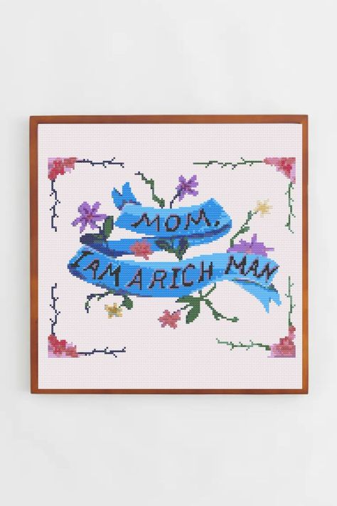 The sentence "Mom I am a Rich Man" in a blue ribbon, with pink and purple flowers. Cross Stitch Patter in PDF. Mom I Am Rich Man, Taylor Swift Cross Stitch, 123 Stitch, Pop Culture Quotes, I Am A Rich Man, Quote Cross Stitch, Taylor Swift Music Videos, Dmc Cross Stitch, I Am Rich