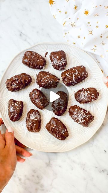 LUBA PAVIA on Instagram: "MY VIRAL 4-INGREDIENT BOUNTY DATES

Gluten-free and refined sugar-free, these bounty dates are a guilt-free indulgence, perfect for satisfying your sweet tooth cravings and loaded with wholesome ingredients.

Save the recipe below and let me know in the comments if you’re going to try it🙌

Ingredients:
Makes 14
1 cup shredded coconut
1/3 cup coconut milk
14 Medjool dates, pitted
150g dark chocolate, melted (I used dairy-free chocolate)
Method:
In a bowl, combine shredded coconut and coconut milk to achieve a soft, bounty-like filling texture. Add more milk if the mixture is too dry.
Stuff each date with the coconut mixture. For faster chocolate coating setting, place the dates in the freezer for 15 minutes.
Remove the dates from the freezer and dip each one into Cook Vegetarian, Plant Based Cookbook, Passover Recipes, Medical Medium, Medjool Dates, Gluten Free Sweets, Dairy Free Chocolate, 4 Ingredient, Chocolate Coating