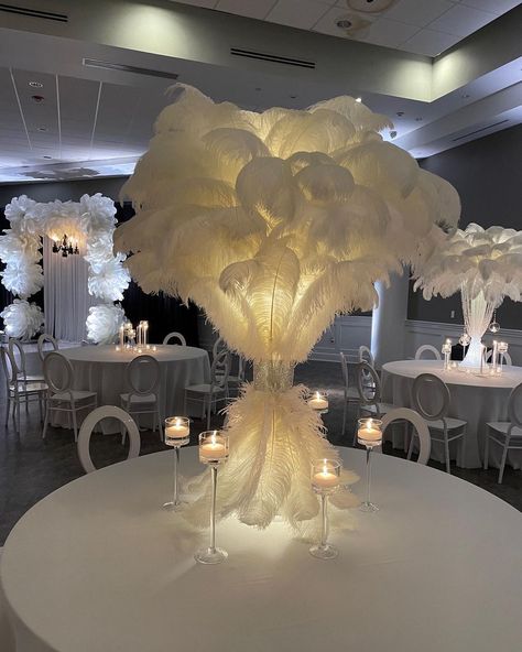 Feathers And Candles Centerpieces, Feather And Pearl Centerpieces, Gold Ostrich Feather Centerpiece, Masquerade Ball Table Decor, White Feather Party Decor, Wedding Ideas Fancy, Black And White Gala Centerpieces, Feather And Flowers Centerpieces, Feather Party Decorations