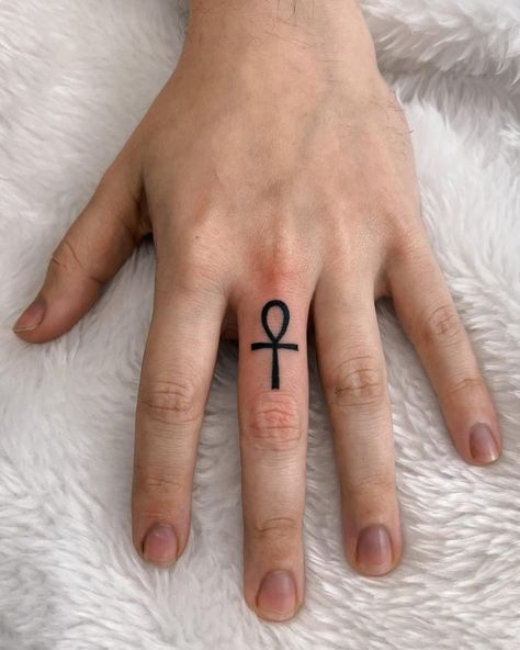 Ankh Tattoos: Meaning, Design Ideas and 30+ Examples - 100 Tattoos Ankh Finger Tattoo, Ankh Tattoos, Cross Finger Tattoos, Ankh Tattoo, Warrior Tattoo Sleeve, Tattoos And Meanings, One Tattoo, Hippie Tattoo, Small Chest Tattoos