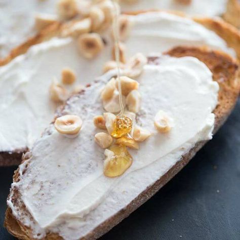 This goat cheese appetizer features lightly toasted bread that is topped with creamy whipped goat cheese, honey and hazelnuts. Party Munchies, Goat Cheese Honey, Honey Goat Cheese, Grilled Sandwiches, Goat Cheese Appetizer, Potato Appetizers, Creamy Goat Cheese, Cheese Appetizer, Whipped Goat Cheese