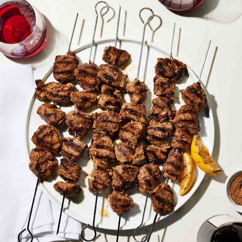 Boti Kebab (Spiced Yogurt–Marinated Lamb Skewers), a classic recipe from Madhur Jaffrey, are seasoned with warming spices like coriander, cumin and nutmeg. Madhur Jaffrey Recipes, Chickpea Pizza, Indian Chicken Dishes, Madhur Jaffrey, Marinated Lamb, Lamb Skewers, Clay Oven, Summer Foods, Skewers Grill