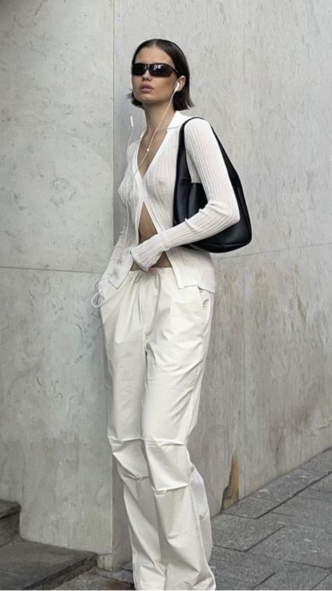 A girl wearing all white with black sunglasses Sheer Top Outfit, Collared Knit Top, Sheer Outfit, Aya Muse, Maximalist Fashion, White Pants Outfit, White Sheer Top, All White Outfit, Quirky Fashion