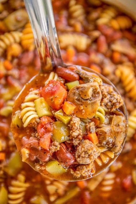 Italian Vegetable Soup - a hearty vegetable soup loaded with Italian sausage and pasta. Ready to eat in 30 minutes. Italian sausage, onion, mushrooms, tomatoes, tomato soup, water, Italian seasoning, carrots, zucchini, green beans, and pasta. Can also make in the slow cooker. Comfort food at its best! #soup #vegetablesoup #italiansausage #zucchini #mushrooms #pasta #slowcooker #freezermeal Italian Sausage And Pasta, Sausage And Pasta, Mushrooms Pasta, Italian Vegetable Soup, Zucchini Mushrooms, Easy Vegetable Soup, Diet Lunch, Hearty Vegetable Soup, Crockpot Recipes Beef Stew