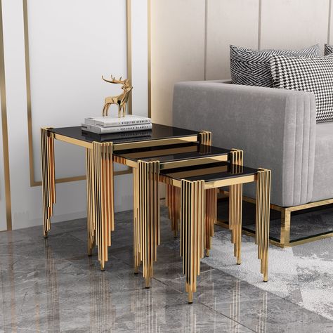 The Dynamite NT200 nest table set is a modern and elegant form for people who love both fascinating patterns and versatility. It is aesthetically pleasing and meticulously completed. The furniture has an exclusive look thanks to the timeless colors of black and gold.The table top is made of tempered glass. Specification Description Table Top Tempered Glass Table Base Metal External Tools Required for Assembly No Warranty 1 Year Product Dimension (cm) Length Width Height Table 1 52 52 51 Table 2 Glass Table Base, Living Tables, Affordable Sofa, Luxury Furniture Living Room, Nest Of Tables, Nesting Table, Sofa Styling, Table 2, Contemporary Luxury