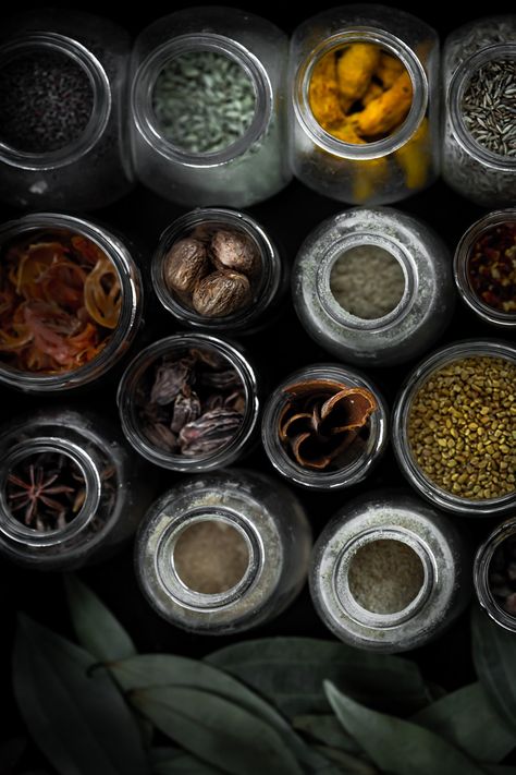 Kitchen apothecary essential and warming spices in rustic moody setting - wellbeing and food photography at boiledbeanstudio.com Moody Apothecary, Apothecary Photography, Apothecary Beauty, Nutrition Photography, Apothecary Aesthetic, Herb Photography, Kitchen Apothecary, Forest Glade, Candle Photography