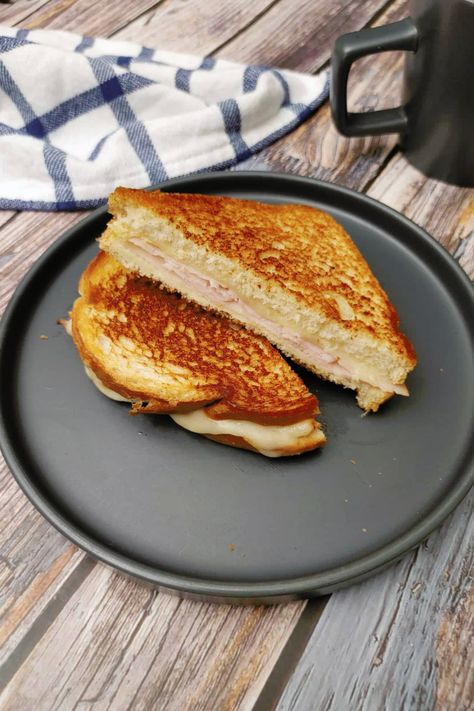 If you're looking for a quick and easy breakfast or brunch option that is both delicious and satisfying, then this recipe for Grilled Ham and Cheese Sandwich is perfect for you! Made with just a few simple ingredients, this sandwich is crispy on the outside and gooey on the inside, with the perfect combination of ham and melty cheese. With a small skillet and a spatula, you can whip up this tasty sandwich in just a few minutes. Grilled Ham And Cheese Sandwich, Grilled Ham And Cheese, Honey Ham, Grilled Ham, Ham And Cheese Sandwich, Deli Ham, Bread Toast, Melty Cheese, Grilled Sandwich