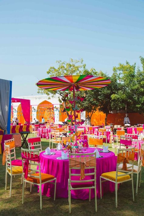 Fresh & Stunning: 15+ Table Decor Centerpieces That Will Work Wonders To Your Wedding! | WedMeGood Haldi Table Centerpiece, Mendhi Centerpieces Table Settings, Colorful Sangeet Decor, Mechanic Decor, Bollywood Party Decorations, Punjabi Wedding Decor, Indian Wedding Centerpieces, Sangeet Decoration, Table Decor Centerpieces