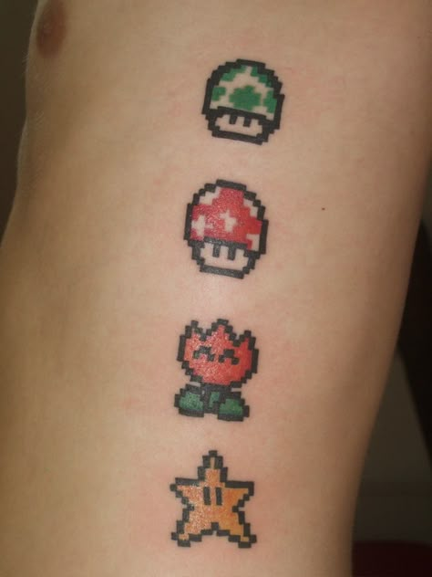 It's no surprise that people love Mario. He's been around for a few decades now and been the main star in so many classic video game adventures, cartoons and even a Hollywood movie! Svtfoe Tattoo, Mario Tattoos, Super Mario Tattoo, Sister Tats, Nintendo Tattoo, Pixel Tattoo, Mario Tattoo, Mario Star, Nerdy Tattoos