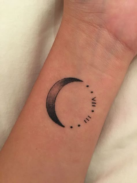 moon-roman-numeral-wrist-tattoo-white-background Small Crescent Moon Tattoo, Moon Tattoo Wrist, Crescent Moon Tattoo Meaning, Tattoos About Growth, Roman Tattoo, Tattoos Behind Ear, Small Moon Tattoos, Roman Numeral Tattoos, Tattoo Moon