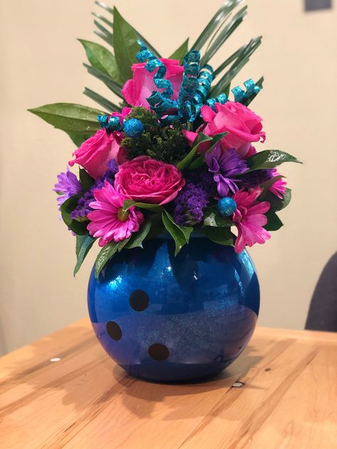 bowling theme, bowling ball, vase made with acrylic fishbowl and bright fresh flowers for a girl’s birthday party Bowling Themed Party, Bowling Graduation Party Ideas, Bowling Decorations, Bowling Crafts, Bowling Banquet Ideas, Bowling Themed Wedding, Bowling Pin Wedding Centerpieces, Bowling Party Table Decorations, Bowling Wedding