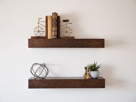 Classic pieces on these beautiful walnut floating shelves ✨ #walnutwood #floatingshelves #elegantdecor Floating Shelf Modern, Walnut Floating Shelf, Walnut Floating Shelves, Modern Floating Shelves, Shelf Modern, Dark Stain, Modern Shelving, Dark Stains, Floating Shelf