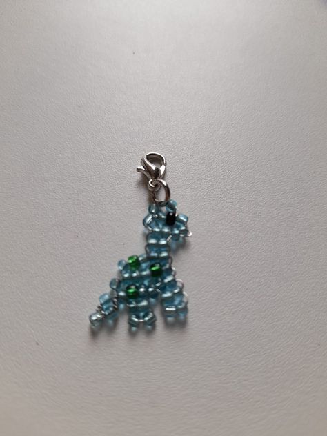 Dino Bead Pattern, Seed Bead Dinosaur, Beaded Dinosaur Pattern, Beaded Dinosaur, Selling Stand, Concert Bracelets, Beads Animals, Pony Bead Animals, Rave Kandi