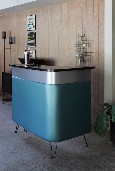 Enjoy cocktails at home with a Boomerang bar in Metallic Turquoise #homebar #homebartender #cocktails #cocktailathome #boomerangbar #atomicpad Mid Century Basement, Bar Reception Desk, Front Reception Desk, Bar Mid Century, Bar Reception, Bridal Boutique Interior, Atomic Decor, Modern Wall Sculptures, Home Bar Cabinet