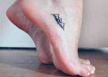 40 Best Foot Tattoos | YourTango Berg Tattoo, Tiny Foot Tattoos, Small Foot Tattoos, Tattoos Mandala, Foot Tattoos For Women, Small Tattoos With Meaning, Small Girl Tattoos, Small Tattoos Simple, Cool Small Tattoos