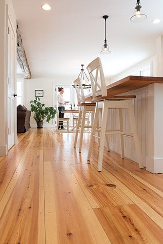 Featuring a warm red heart that contrasts nicely with the creamy soft white of its sapwood, Red Pine has knots that add interest, making it perfect for that “Knotty Pine” look. #redpine #pinefloors #woodfloors #interiors #residential Knotty Pine Floors Wide Plank, Red Pine Floors, Knotty Pine Floors, Warm Hardwood Floors, White Pine Floors, Pine Hardwood Floors, Warm Wood Floors, Pine Wood Floors, Floor Stain Colors