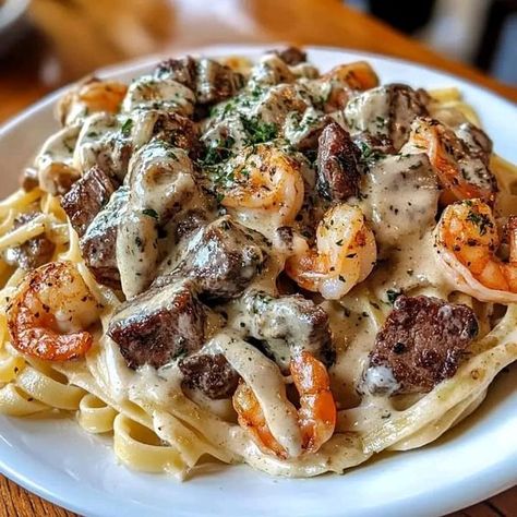 Brooke Williamson | This Creamy Cajun Shrimp and Steak Alfredo Pasta is the ultimate comfort food | Facebook Shrimp And Steak Alfredo Pasta, Steak Alfredo Pasta, Steak Alfredo, Brooke Williamson, Creamy Cajun Shrimp, French Beef Stew, Steak Pasta, Cajun Pasta, Chicken Alfredo Recipes